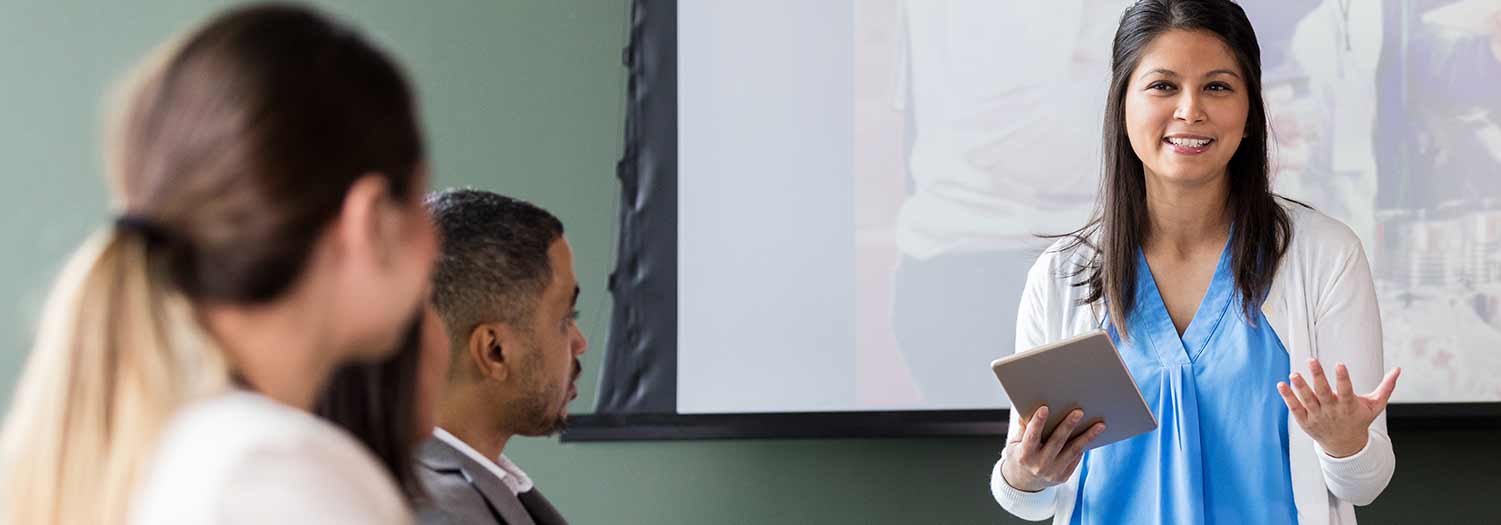 Woman presenting in board meeting