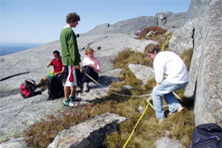 MERE- students researching rocks on mountain side