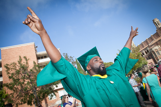 AULA Commencement2 › Antioch University proud graduate in gradation attire