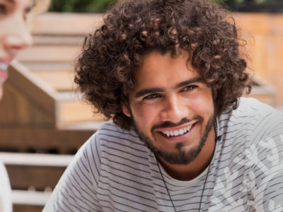 Smiling man in striped shirt