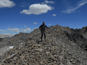 Timbo › Antioch University Timbo- Man standing on rocky mountain side
