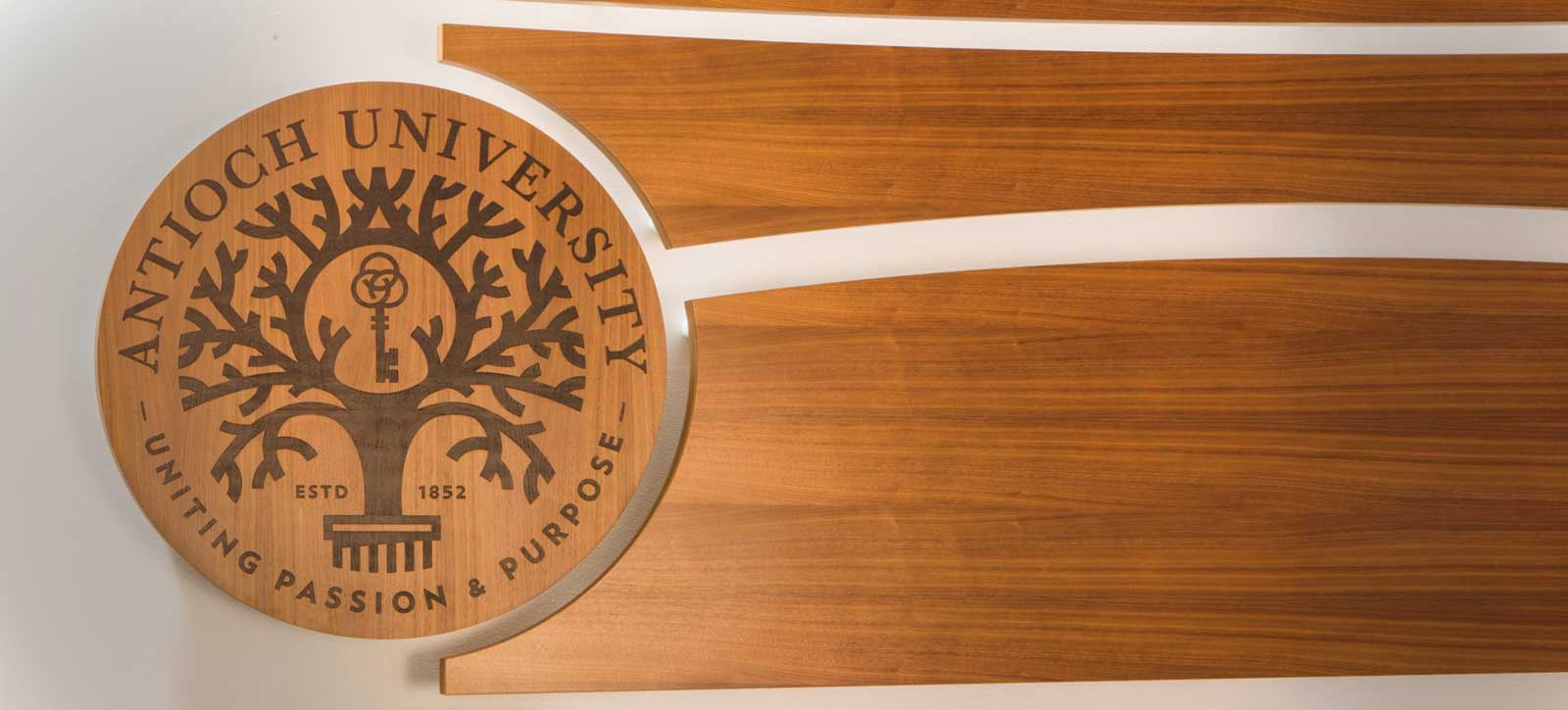 AU_Hero_Images_Wood_Seal › Antioch University wooden Antioch university seal