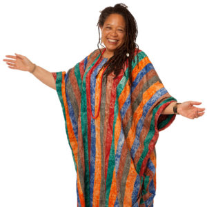 Claudia J. Ford standing in a beautiful striped robe.
