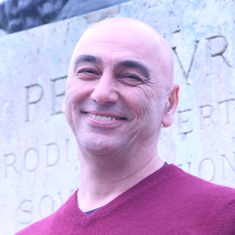 Smiling man in red sweater - Tony Kashani