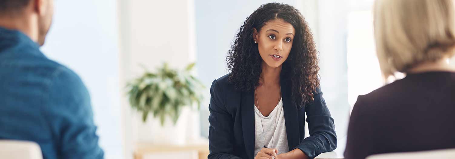 GettyImages-843530298-hero › Antioch University Woman speaking to group