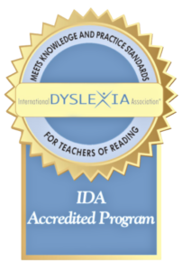 Accreditation Logo_T › Antioch University Emblem representing a dyslexia certified program, showcasing a book icon and the phrase "Dyslexia Certified Program