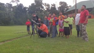 group of young children looking at birds