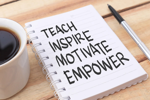 Notebook with the words- teach, inspire, motivate, empower