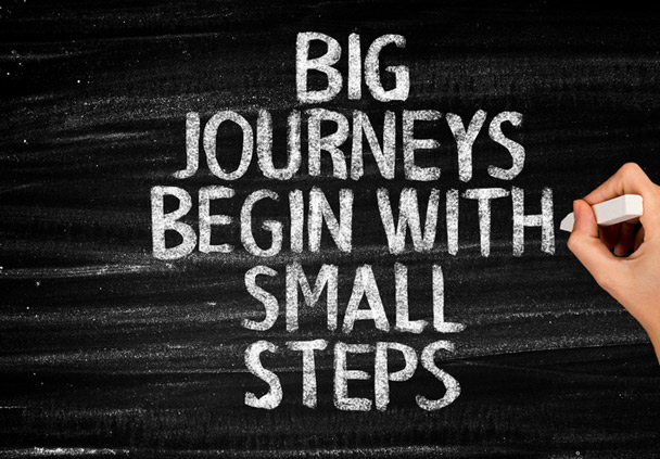 Chalkboard that says, big journeys start with small steps.