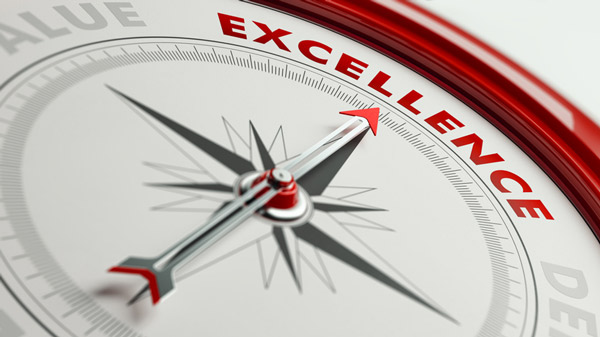 A compass pointing toward the word excellence in red.
