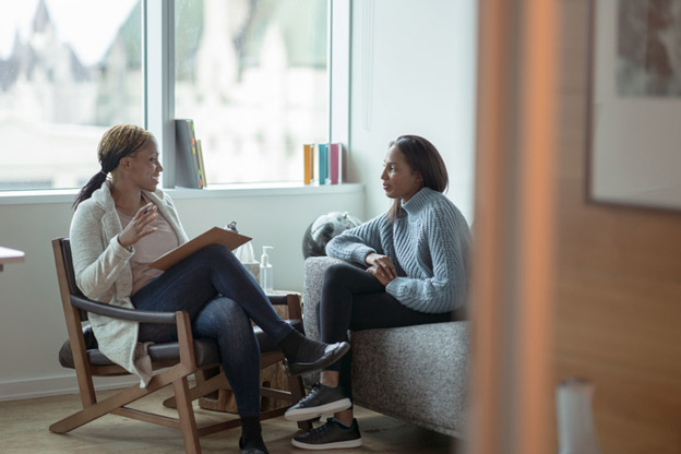 Two people in a therapy session.