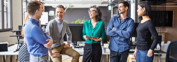 Business people talking while standing up.