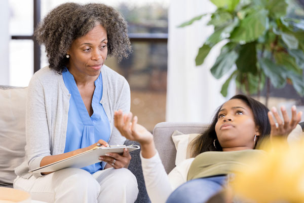 Therapist talking to her client.