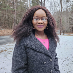 Jean Kayira smiling outside in the snow