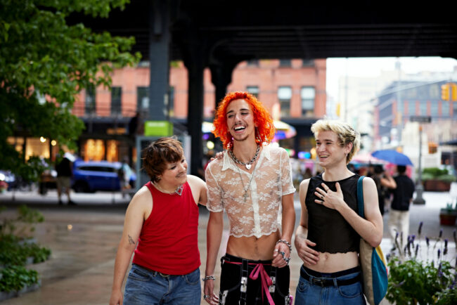 Young gay friends walking in New York City summertime › Antioch University