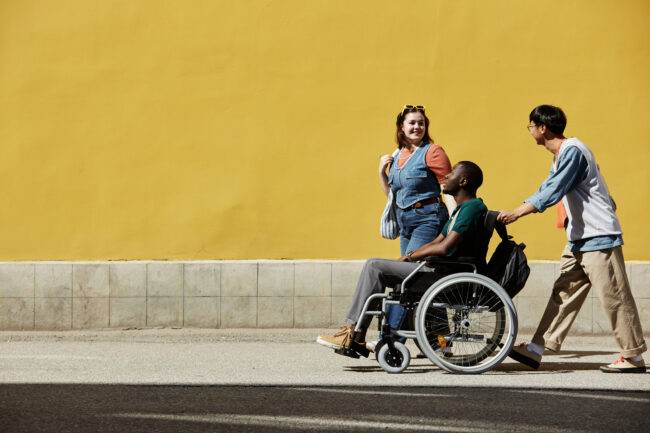 Wide Angle Group of Friends with Black Man using Wheelchair › Antioch University