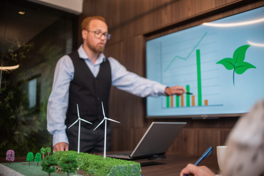 Businesspeople talking about renewable energy | Antioch University